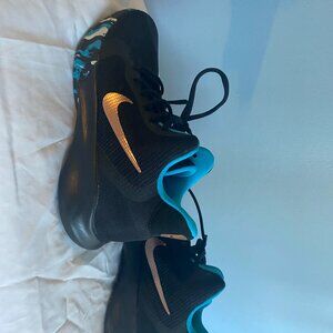 Nike sneaker- used black- multi color with gold logo size mens 7